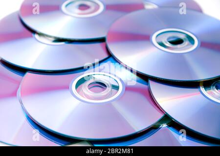 Colorful CD, DVD stack wallpaper background Stock Photo