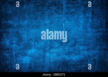 Blue wall background with darker black grungy border and vintage texture design. Stock Photo
