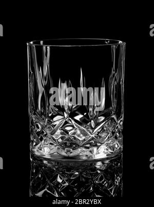 Empty glass for whiskey on a black background Stock Photo