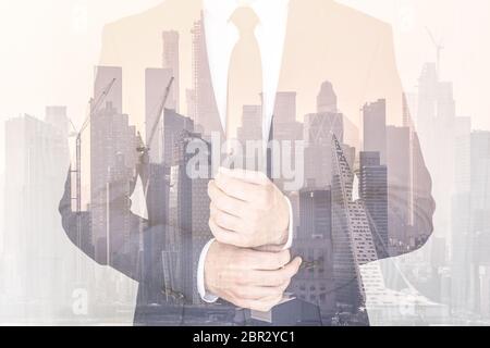 Corporate business, entrepreneurship and economic prosperity conceptul collage. Businessman wearing fashionable classic navy blue suit against new yor Stock Photo