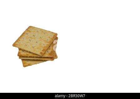 Cracker biscuits over white background. Selective focus Stock Photo