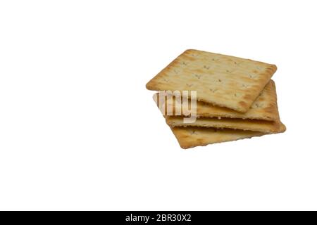 Cracker biscuits over white background. Selective focus Stock Photo