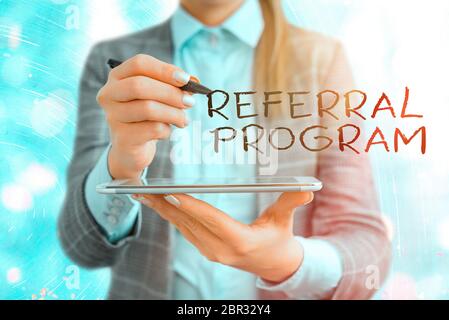 Text sign showing Referral Program. Business photo text employees are rewarded for introducing suitable recruits Stock Photo