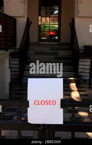 Closed sign outside a business in downtown Tucson, AZ Stock Photo