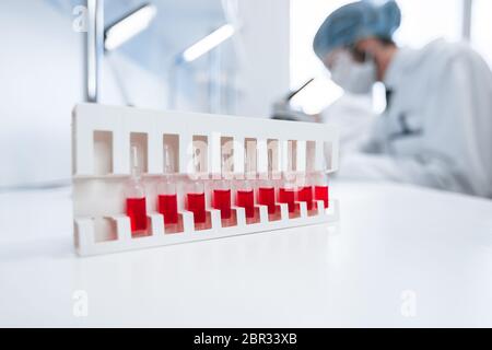 background image of a test tube with test results on a table in the laboratory . Stock Photo