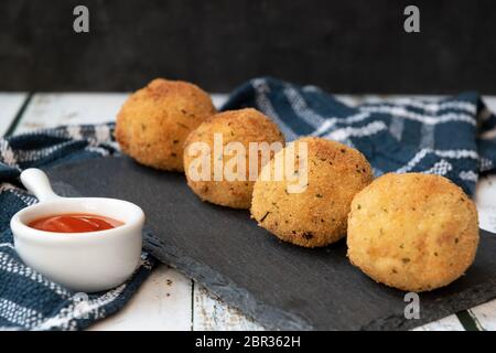 crispy potato balls with tuna and onion Stock Photo