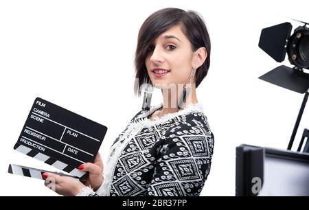 a woman holding a clapboard. Isolated on the white background Stock Photo
