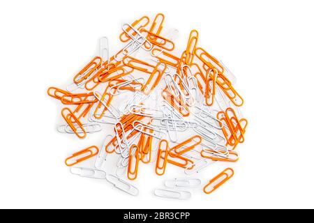 White and Orange Paper clips isolated on a white background. Stock Photo