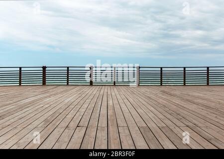 wooden platform and fence on a background of the sea Stock Photo