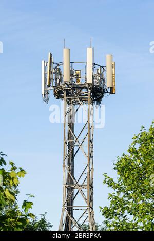 A mobile phone mast in the UK. Theme: mobile telecommunications sector, mobile telephone mast, telecoms, technology, 5g, 4g, 3g, conspiracy theories Stock Photo