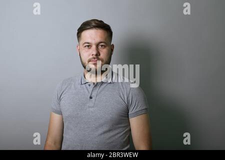 Portrait Of A Serious Man Who Looks Straight At The Camera. Stock Photo