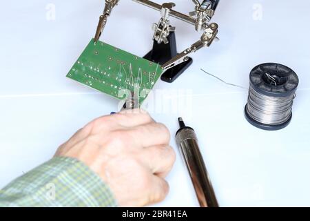electric technician is installing some digital devices Stock Photo