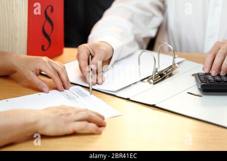 business man is working on a tax document in office Stock Photo
