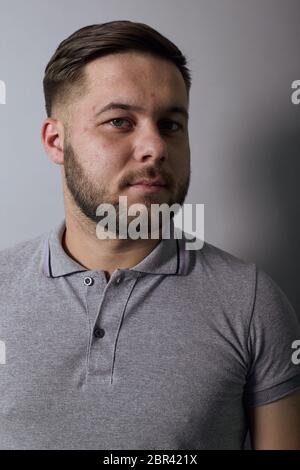 Portrait Of A Serious Male Who Looks Away. Close Up Stock Photo