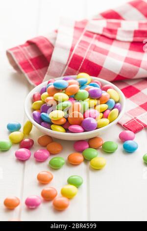 Colorful chocolate candy pills in bowl. Stock Photo