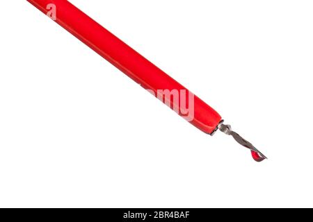 side view of ink drop in red nib pen close up isolated on white background Stock Photo