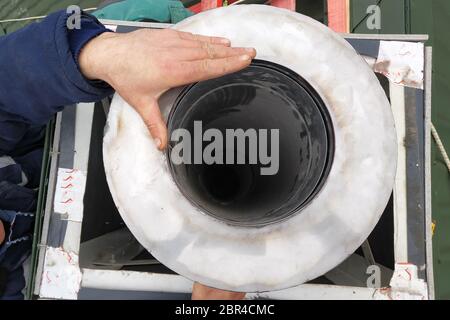 Aluminum ventilation chimneys, the master installs on the roof of the house. Smoke pipe for smoke from the kitchen.2020 Stock Photo