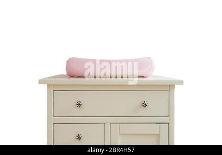 Changing mat in baby room modern design, isolated pink colors close-up Stock Photo