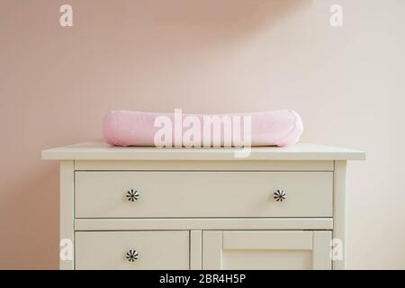 Changing mat in baby room modern design, pink colors cute Stock Photo