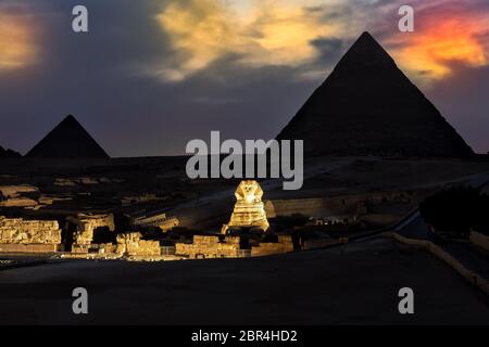 The Pyramids and the Sphinx in the evening show lights, Giza. Stock Photo