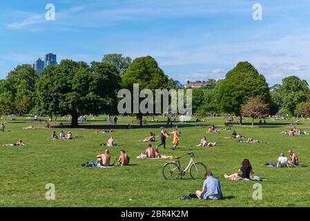 Crowds in Clissold Park, Stoke Newington, North London, on the 20th May 2020, on the warmest day of the year during the lockdown Stock Photo