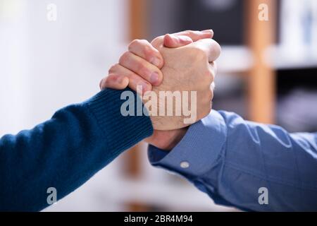 Close-up Of A Two Businessman Competing In Arm Wrestling Stock Photo