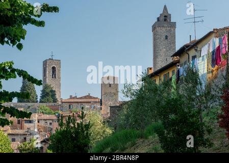 Streets and towers of San Gimignano, small medieval town in Tuscany, Italy Stock Photo