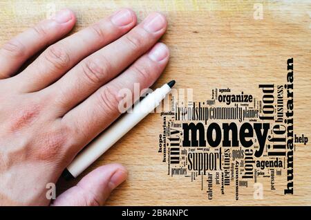 Money word cloud business concept over wooden background Stock Photo
