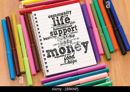 Money word cloud business concept over notepad background Stock Photo