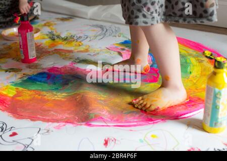 Children painting rainbows Stock Photo