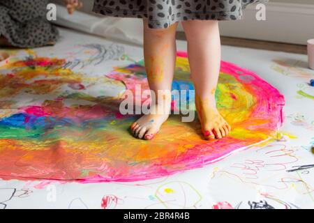 Children painting rainbows Stock Photo