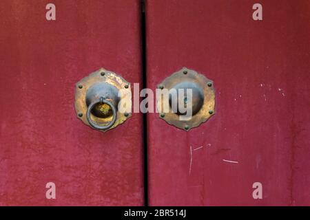 Old vintage Chinese door knob knockers in Hutong narrow alley in Beijing, China Stock Photo