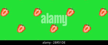 Seamless Pattern made with slices of strawberry on green background,panorama. Stock Photo