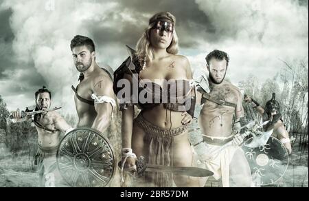 Ancient warrior or Gladiator's group ready to fight outdoors Stock Photo
