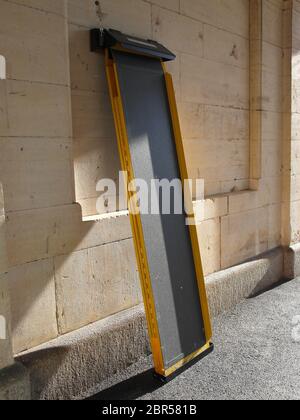 Platform ramp at railway station to assist entry and exit between station platform and train carriages. Stock Photo