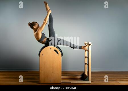 Beautiful Woman Doing Pilates Exercise Training On Barrels Barrel Reformer  Correct Posture Healthy Locomotor System Stock Photo - Download Image Now -  iStock