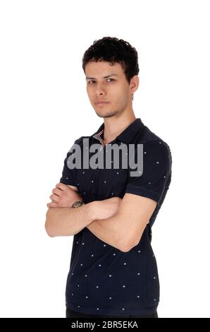 A close up image of a young good looking man, standing in the studio waist up, looking serious, isolated for white background Stock Photo