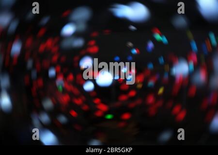 Blurred LED screen closeup. Glowing threads in a color spectrum on a black background. Stock Photo