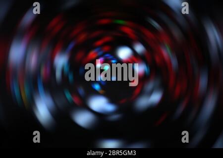 Blurred LED screen closeup. Glowing threads in a color spectrum on a black background. Stock Photo
