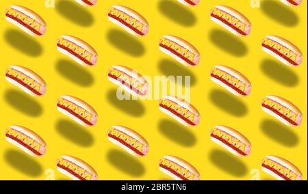 seamless pattern of hot dogs on yellow background. Stock Photo