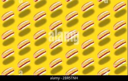 seamless pattern of hot dogs on yellow background. Stock Photo