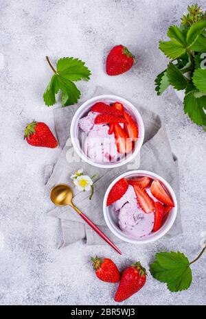 Strawberry ice cream in white bowl Stock Photo