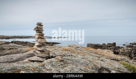 cairn on a hiking trail on the island of Yeu, France Stock Photo