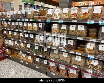 Orlando, FL/USA-5/4/20:  A display of snacks in plastic containers at a Publix grocery store waiting for customers to purchase. Stock Photo
