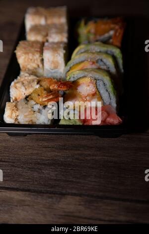 Close up of sushi rolls with crab, avocado, and shrimp Stock Photo