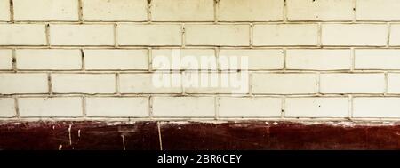 Panoramic canvas of old uneven block shape white and red color wide brick wall background of a vintage house facade. Modern style design decorative id Stock Photo