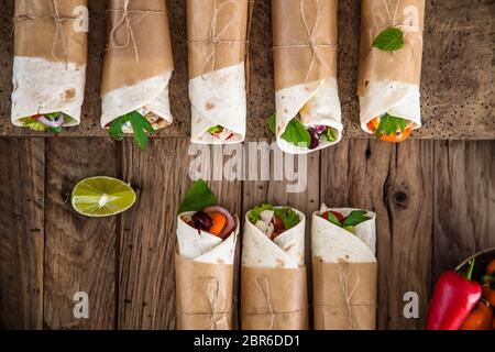 Tortilla wraps with vegetables. Mexican tortillas. Tacos with nachos and vegetables Stock Photo