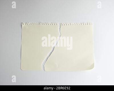 sheet of white paper torn in half with a spiral notepad, close up Stock  Photo - Alamy
