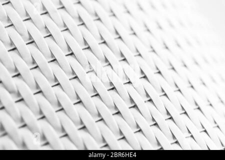 White wicker pattern, bent plastic furniture surface, background photo with selective focus Stock Photo