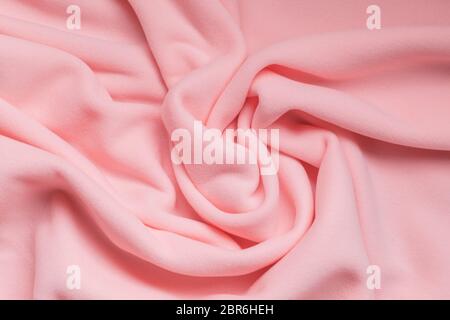 Background texture of pink fleece, soft napped insulating fabric made of polyester Stock Photo